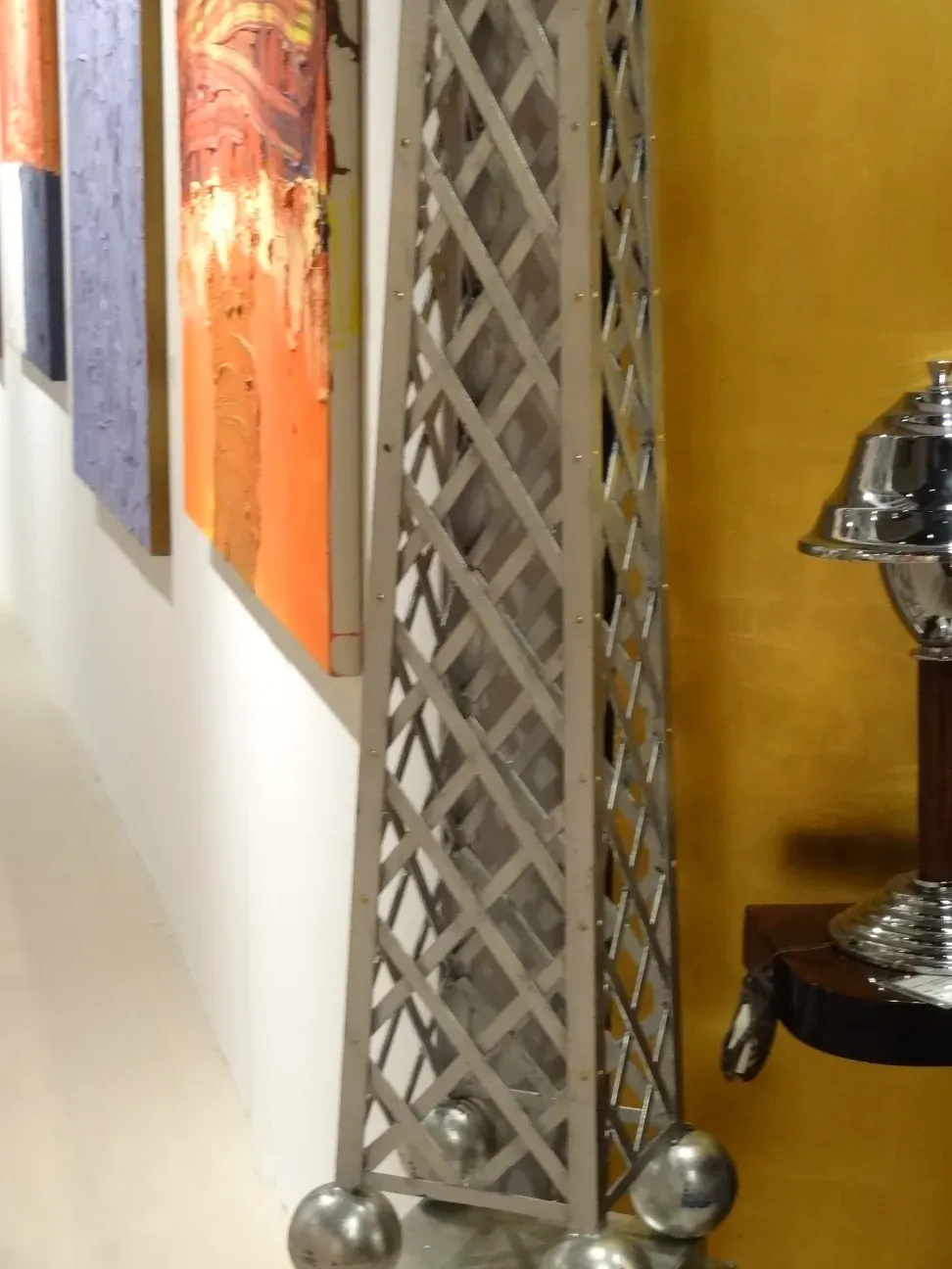 Antique obelisk with a decorative style in a modern setting.