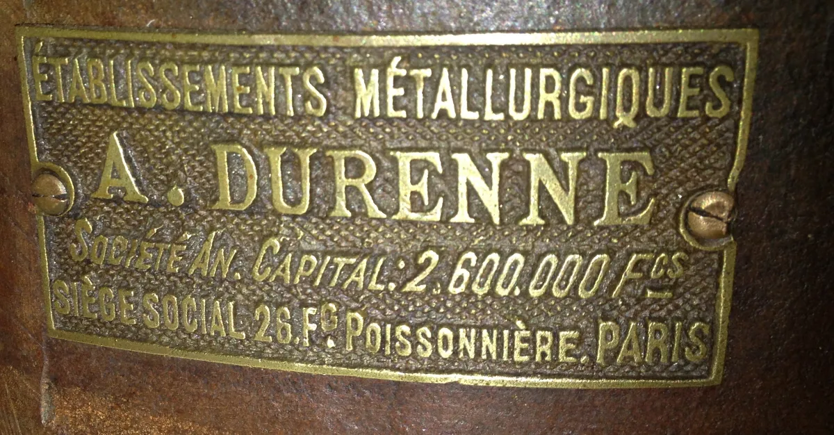 Antique A. Durenne plaque with intricate details and clear text.