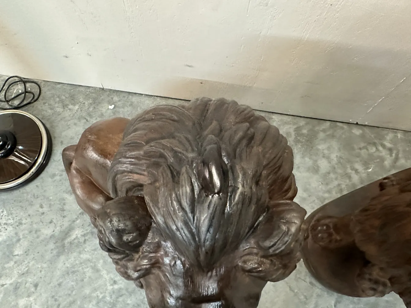 antique sculpture of two lions with fine details