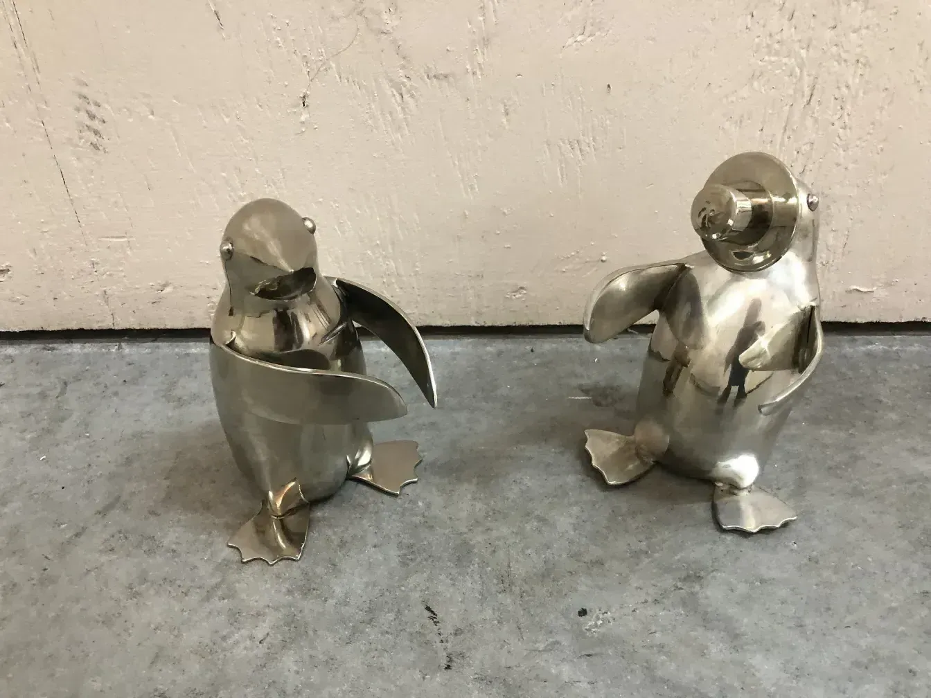 Two antique decorative penguins with elegant shapes
