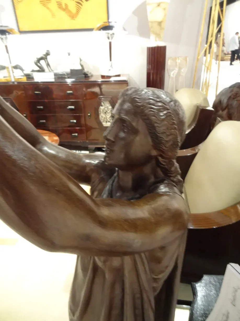 Antique sculpture by Val D'Osne with elegant details and smooth curves.