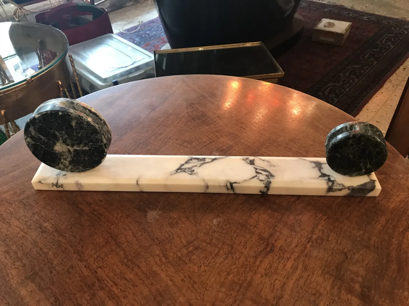 Antique picture frame with round bases, decorated, on table