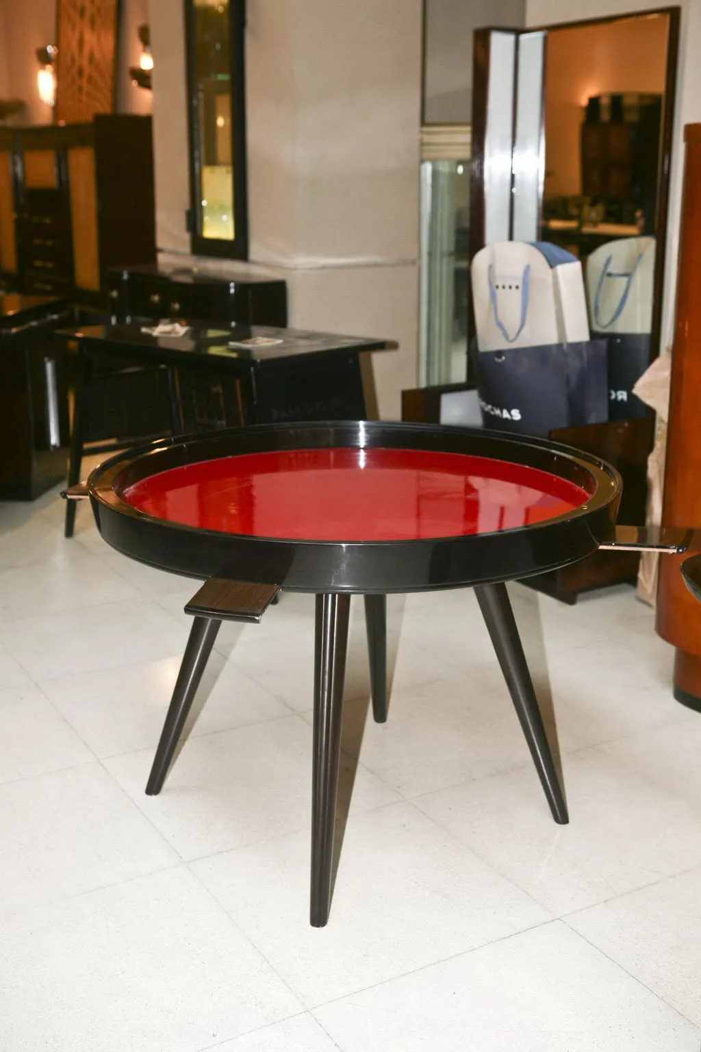 antique dining table for 4 people in red and black with stylish legs