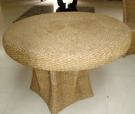 Antique round dining table for four people in a modern environment.