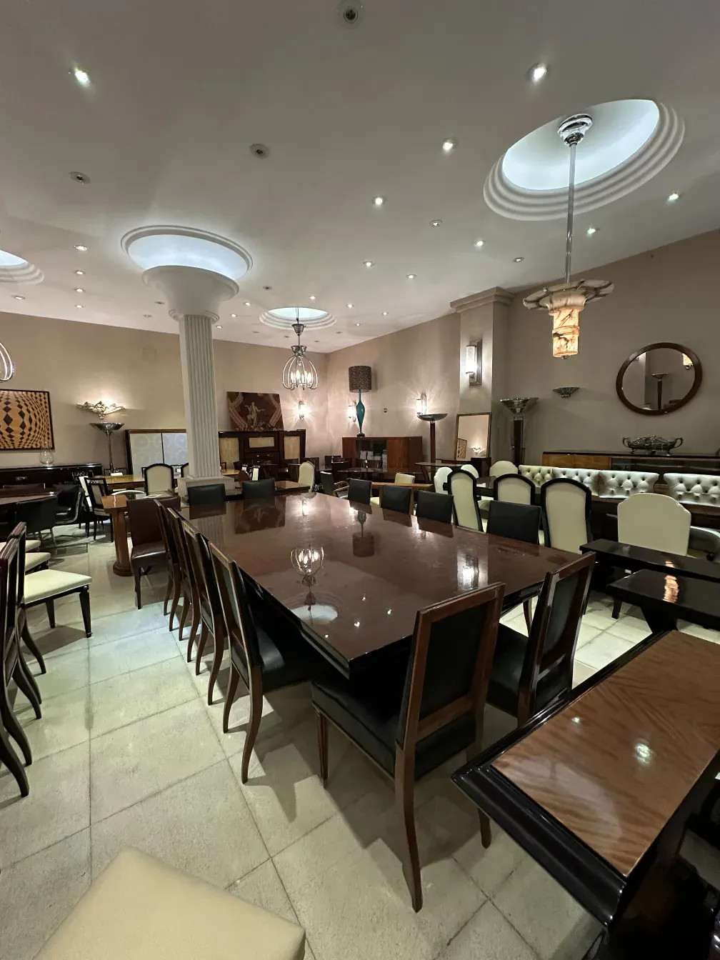 antique dining table for 14 people in an elegant setting