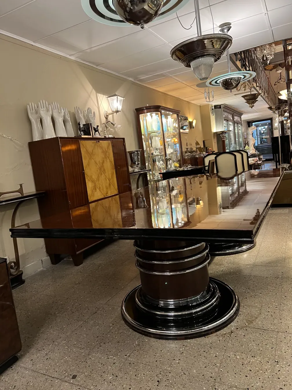 Antique dining table for 14 people in an elegant setting.