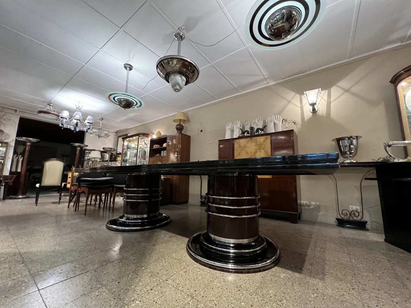 Antique dining table for 14 people in an elegant setting