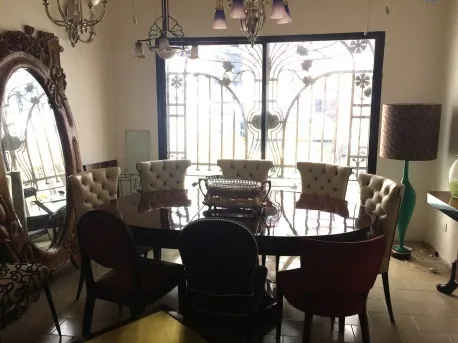 antique dining table for 4-8 people with elegant seating and cozy environment.