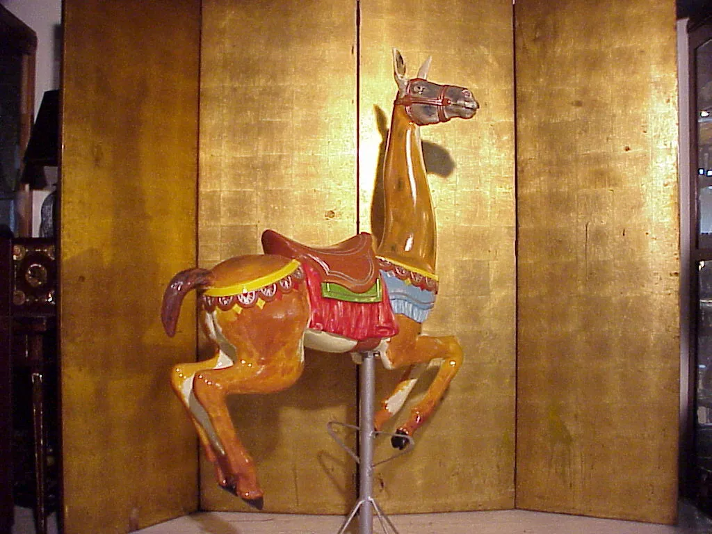 antique sculpture of llama with vibrant colors