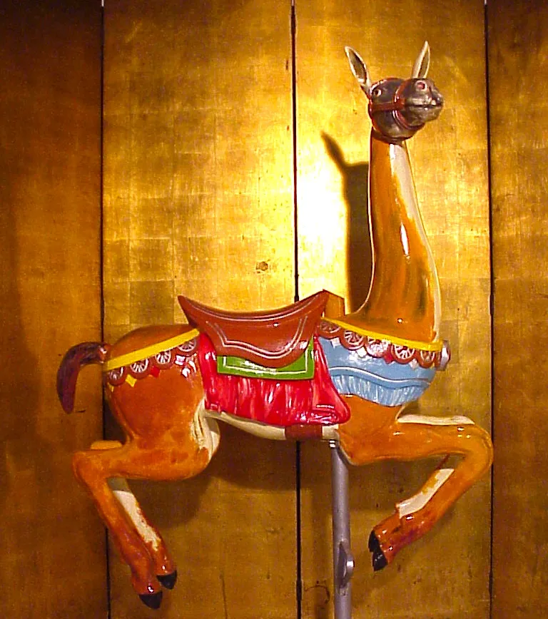 Antique llama figure with bright colors and a golden background.