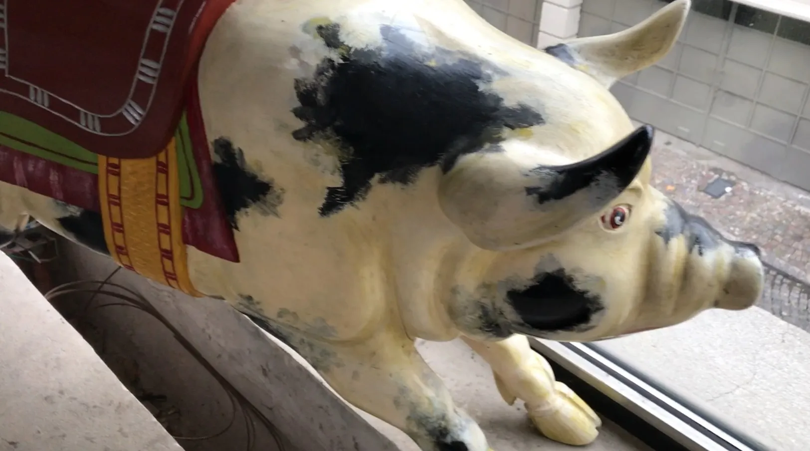 Antique decorative pig with vibrant and colorful details
