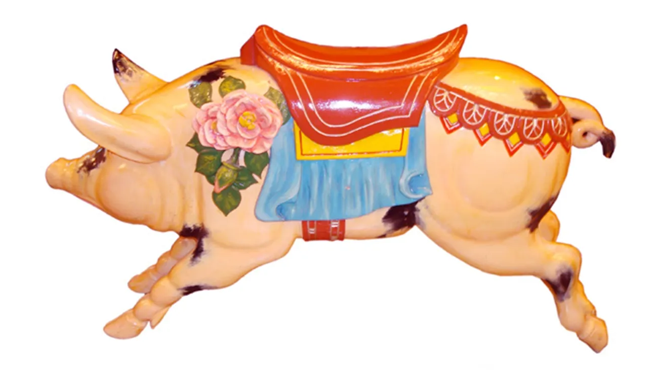 Antique decorative pig with floral details and accessories