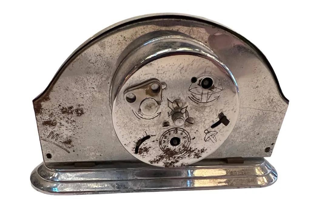 antique clock with distinct design and visible markings