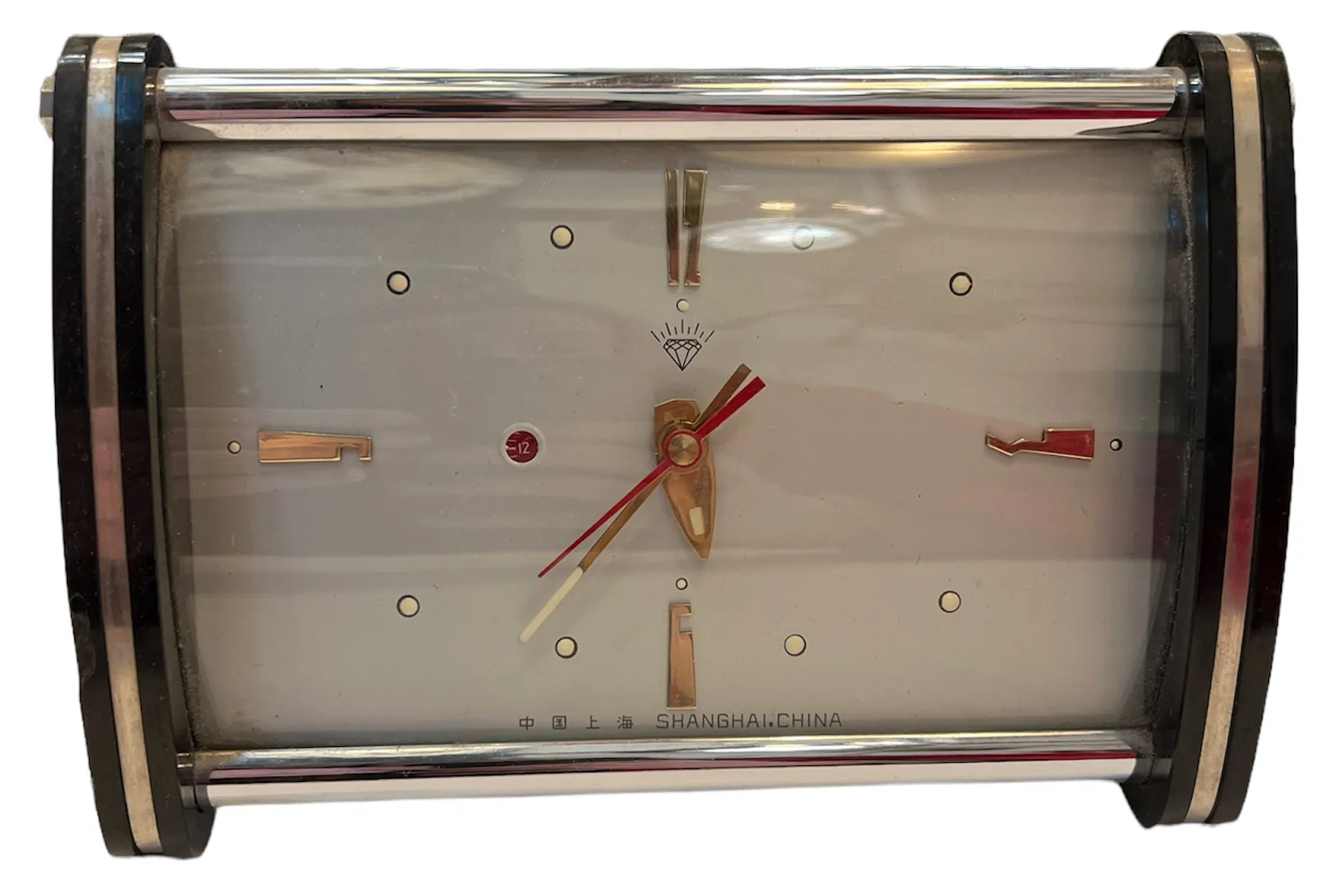 Antique table clock with gold hands and light background