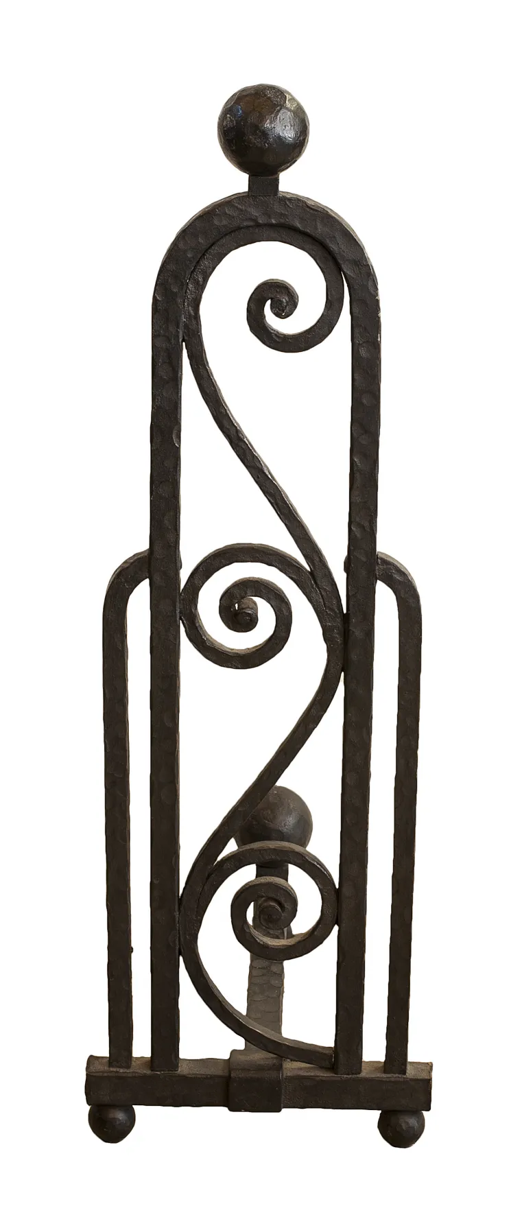 Antique andirons with spiral design and ball top, creating a warm ambiance.