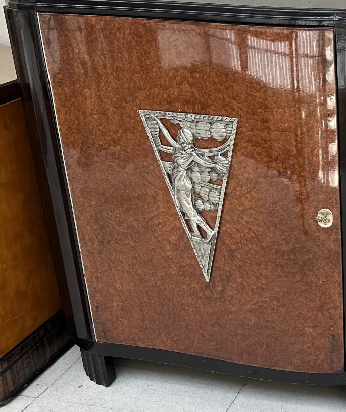 antique art deco sideboard featuring relief design