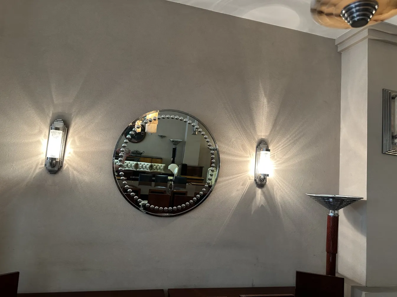 antique round mirror with art deco details