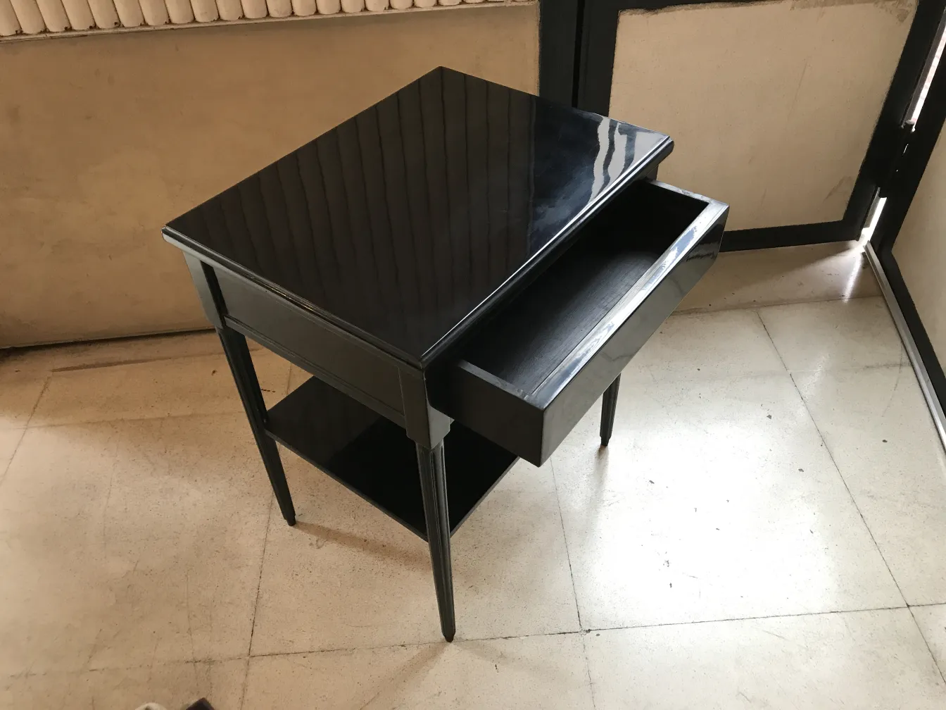 black antique bedside table with drawer and lower shelf