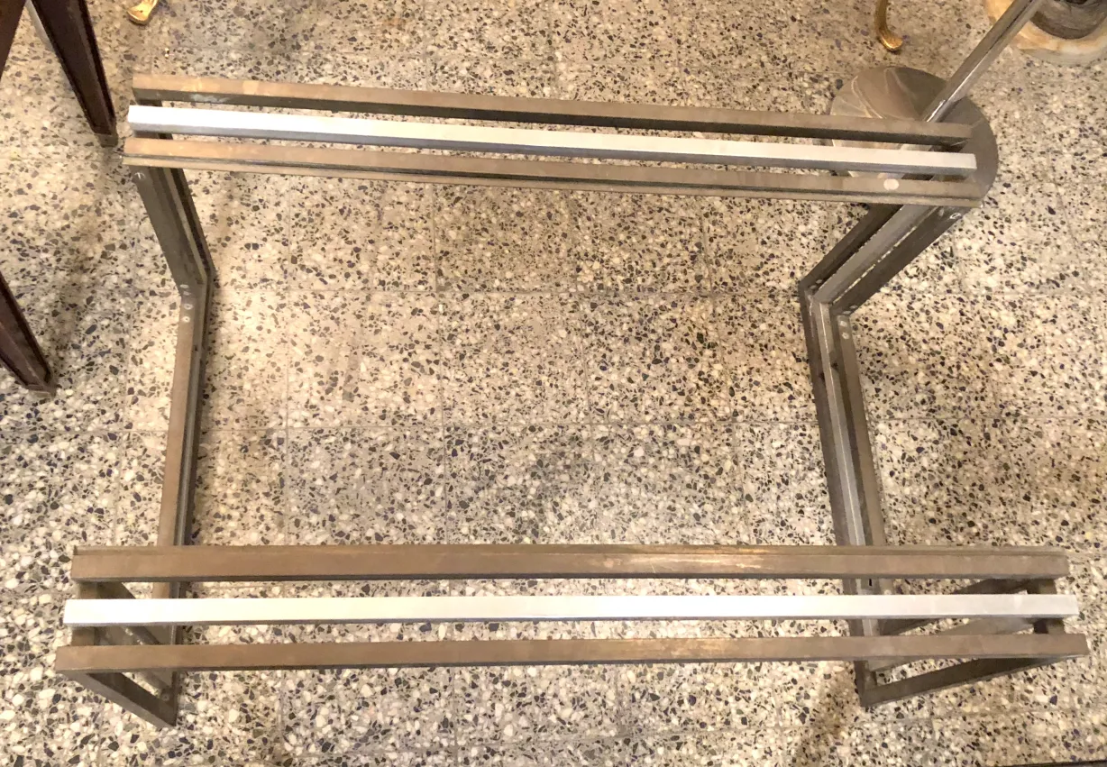 antique art deco coffee table with unique design over stone floor