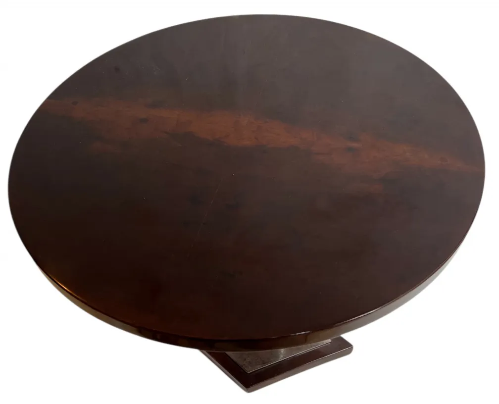 Antique round table in Art Deco style with dark finish.