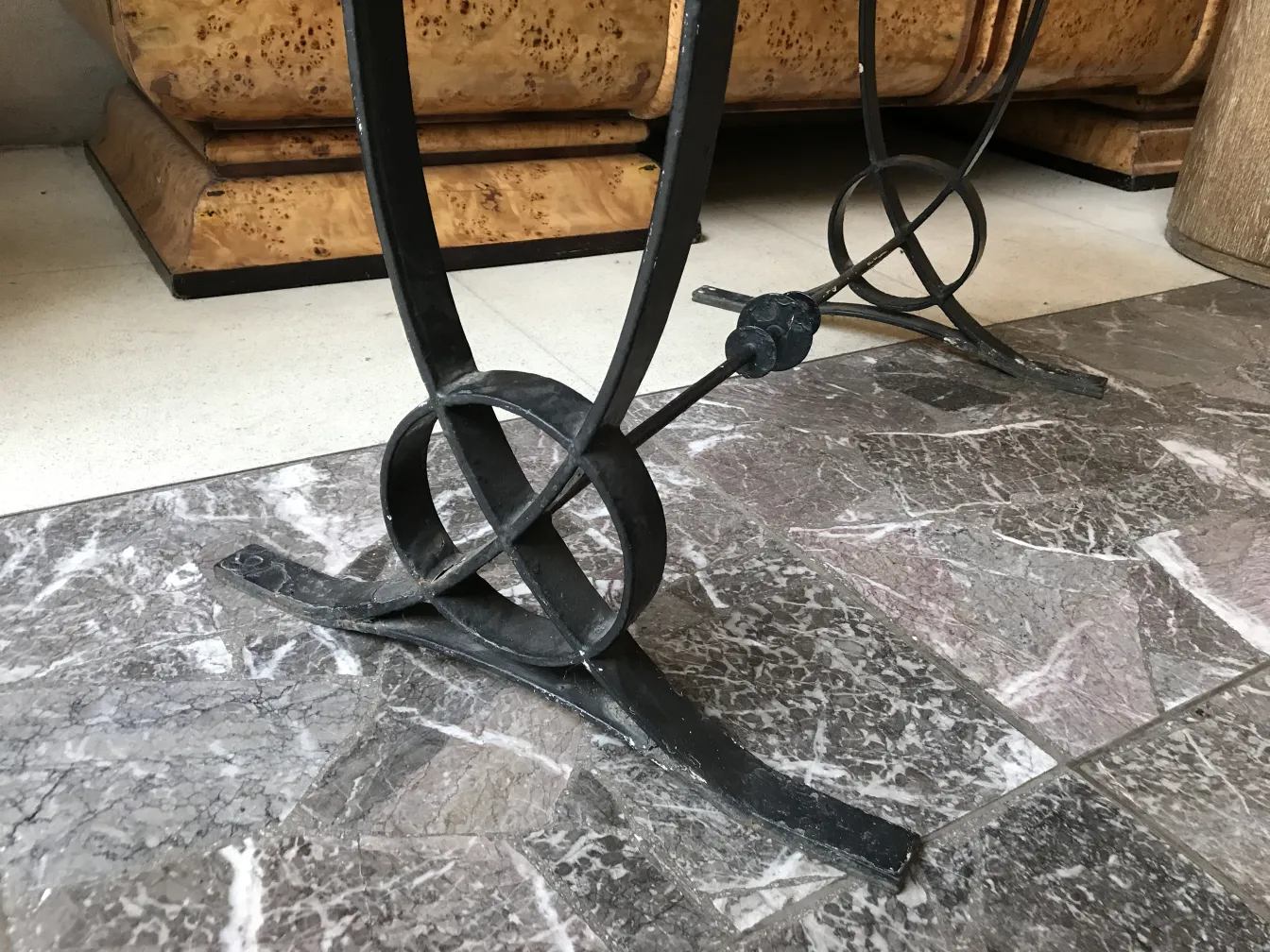 antique art deco table with decorative base in a stylish setting