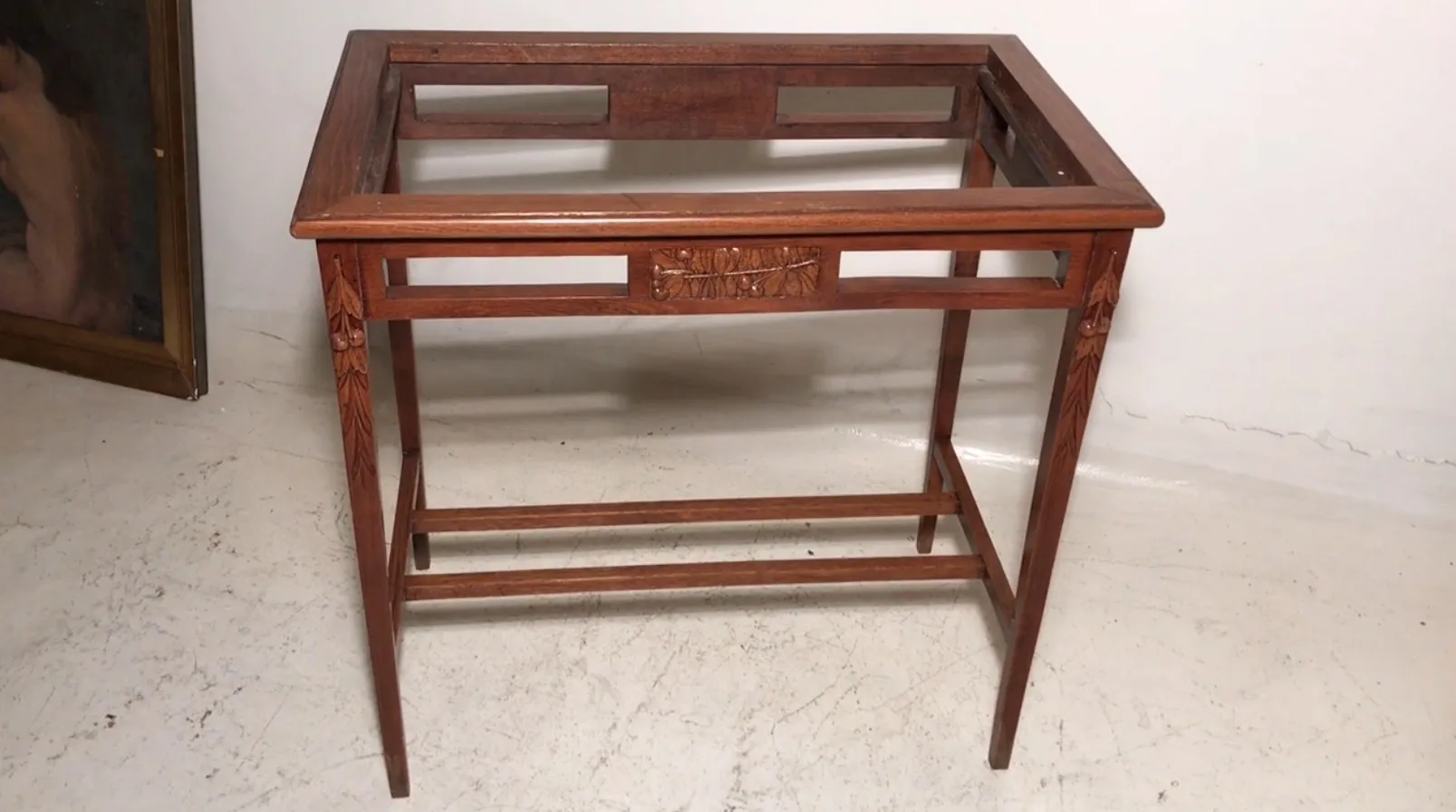 antique table with Art Nouveau decorative details