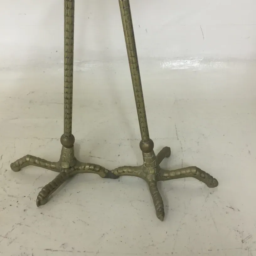 two antique small tables with decorative leg details, neutral setting