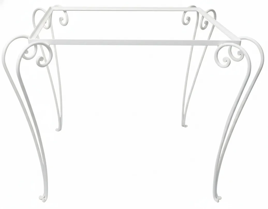 antique table with decorative legs in a garden setting