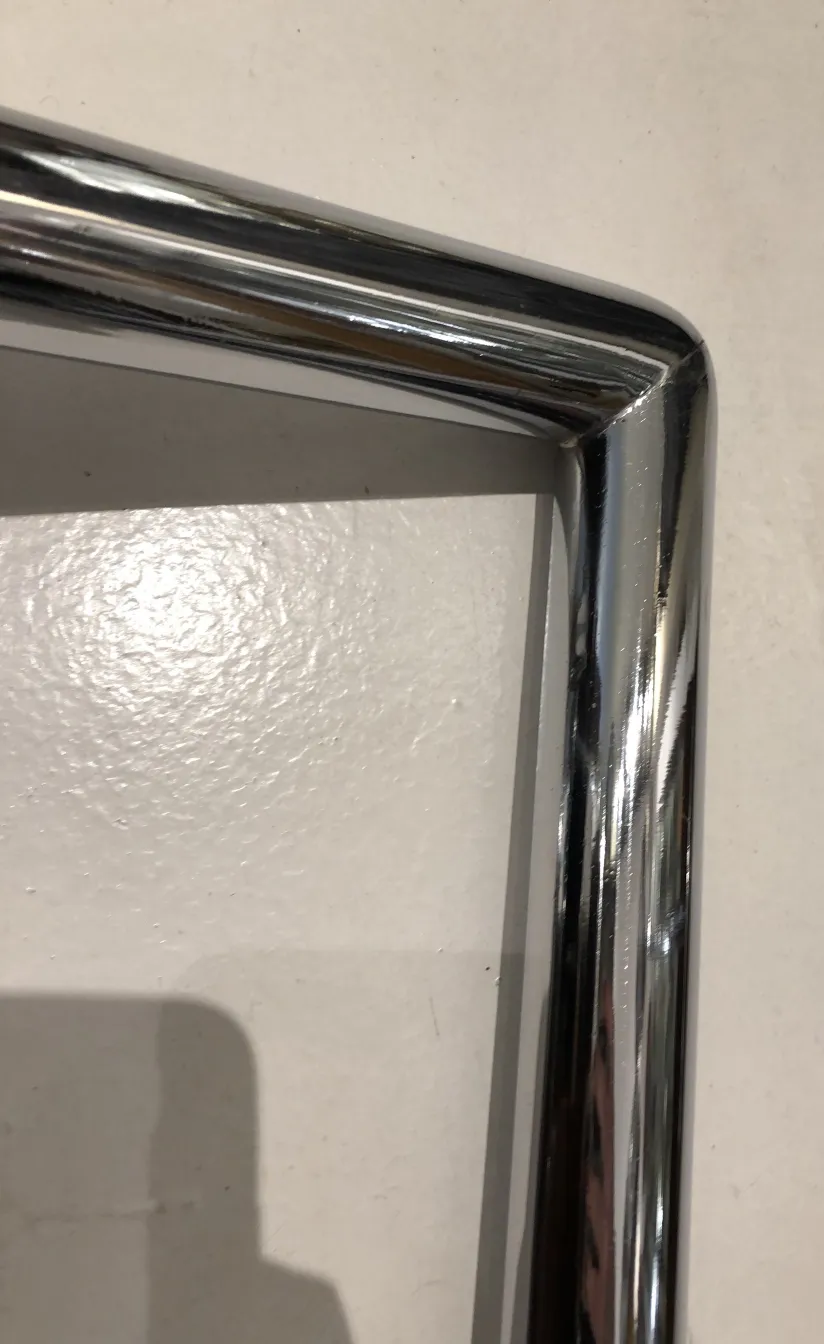 angled view of antique door handles with shiny design