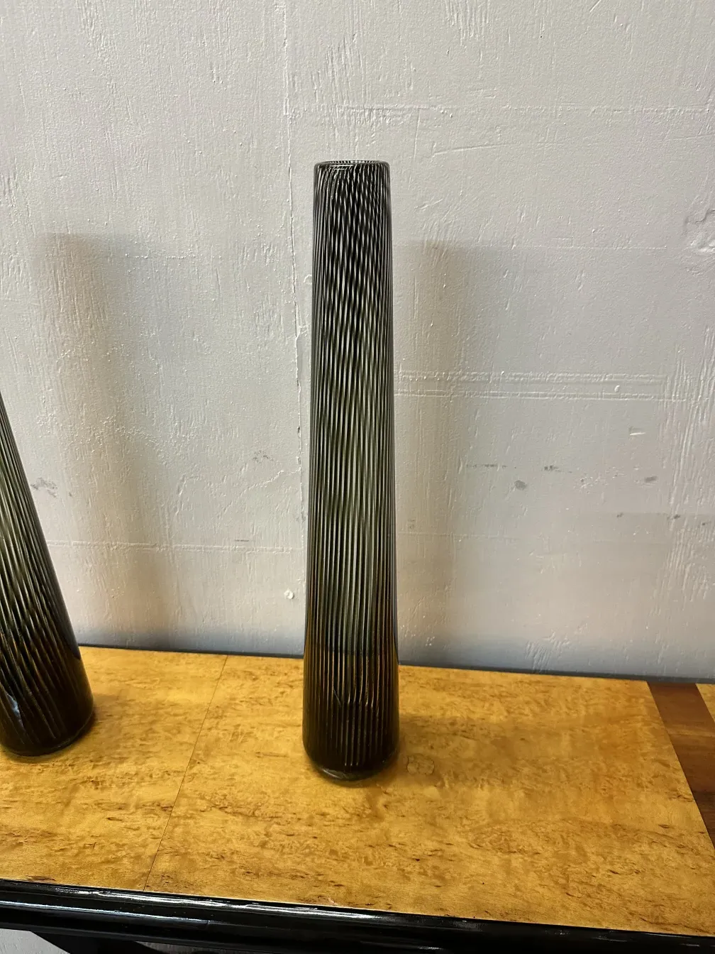 2 antique Murano vases with unique design in an elegant setting.