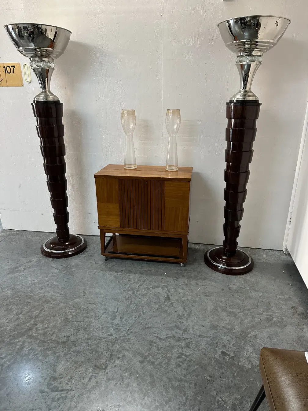 two tall antique murano vases in an elegant setting