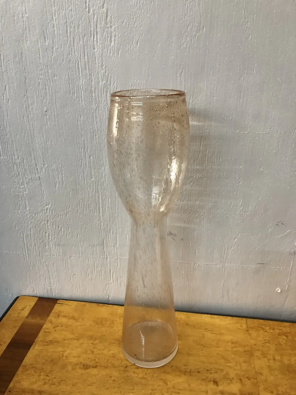 Antique murano vase with distinctive design, enhancing an elegant setting.