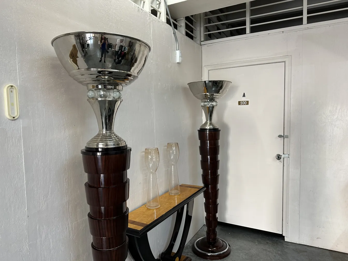 two antique Murano vases beside a furniture, stylish design