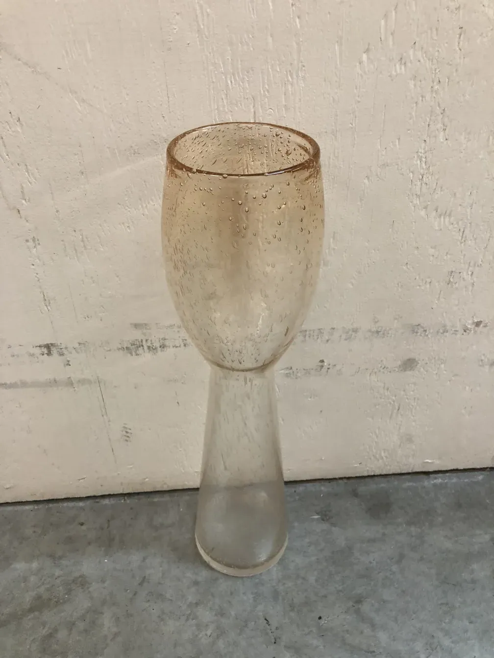 two antique murano vases with decorative bubbles in a neutral setting