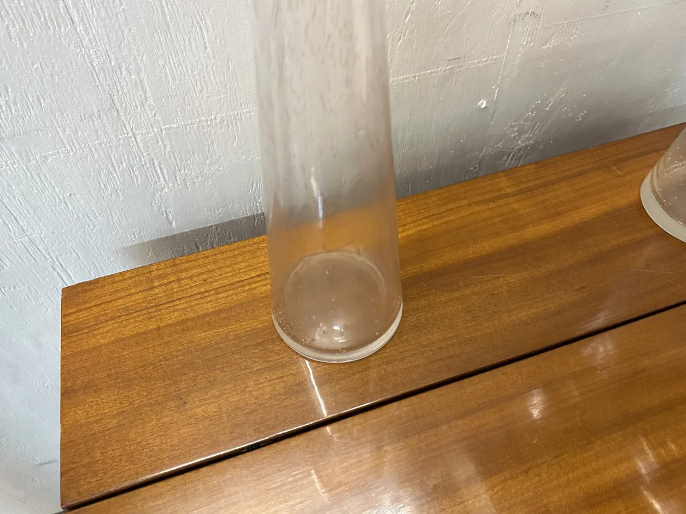 2 antique Murano vases on wooden table