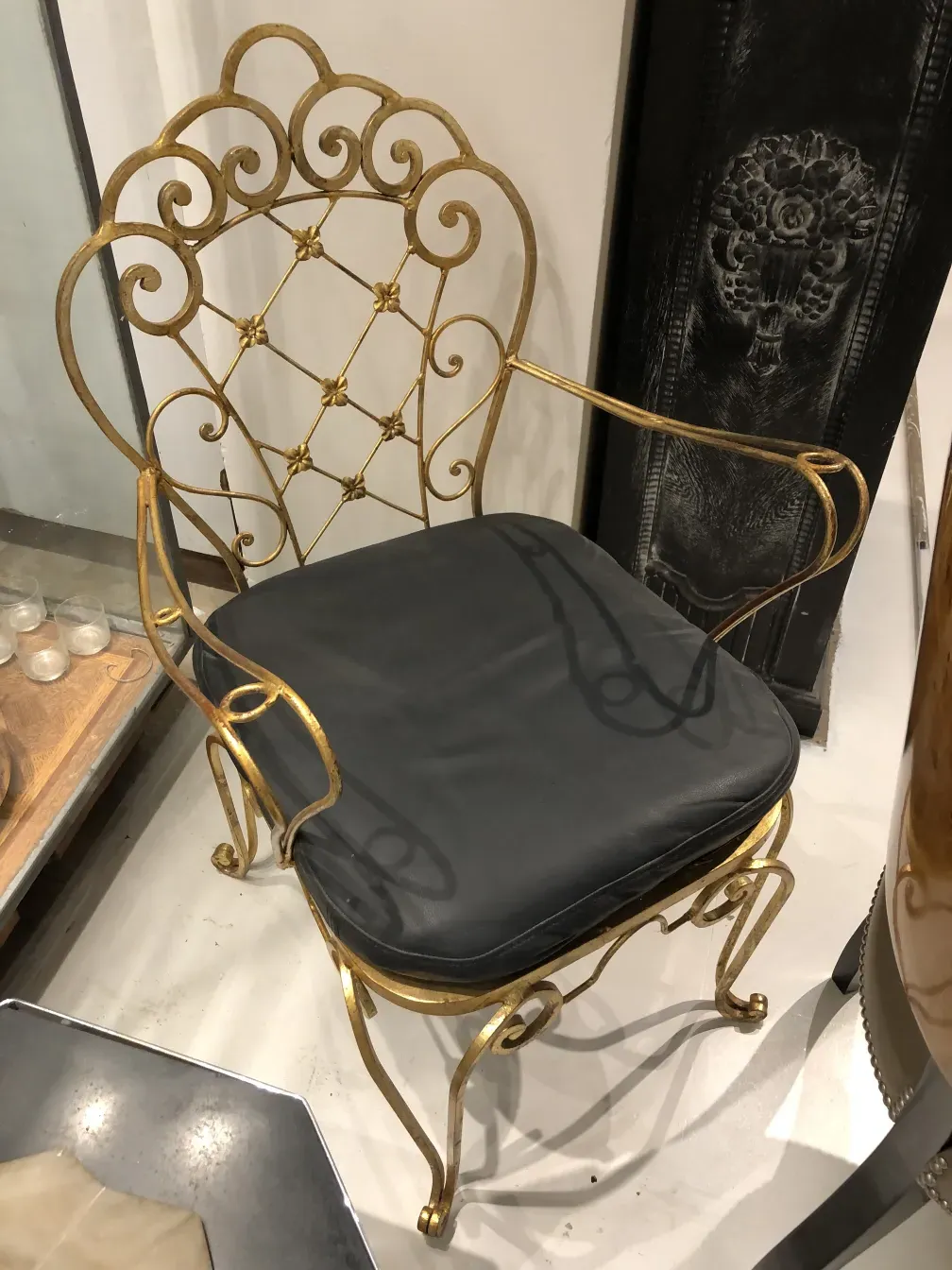 Antique art deco garden armchairs with a modern design, golden details, and an elegant ambiance.