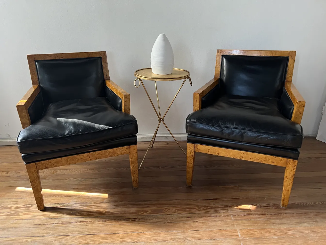 Set of 2 aged armchairs in a cozy environment.