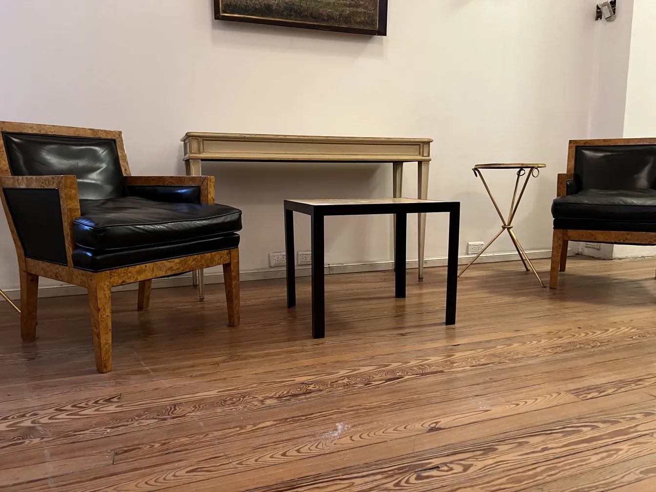 Two antique armchairs with elegant design in a minimalist room.