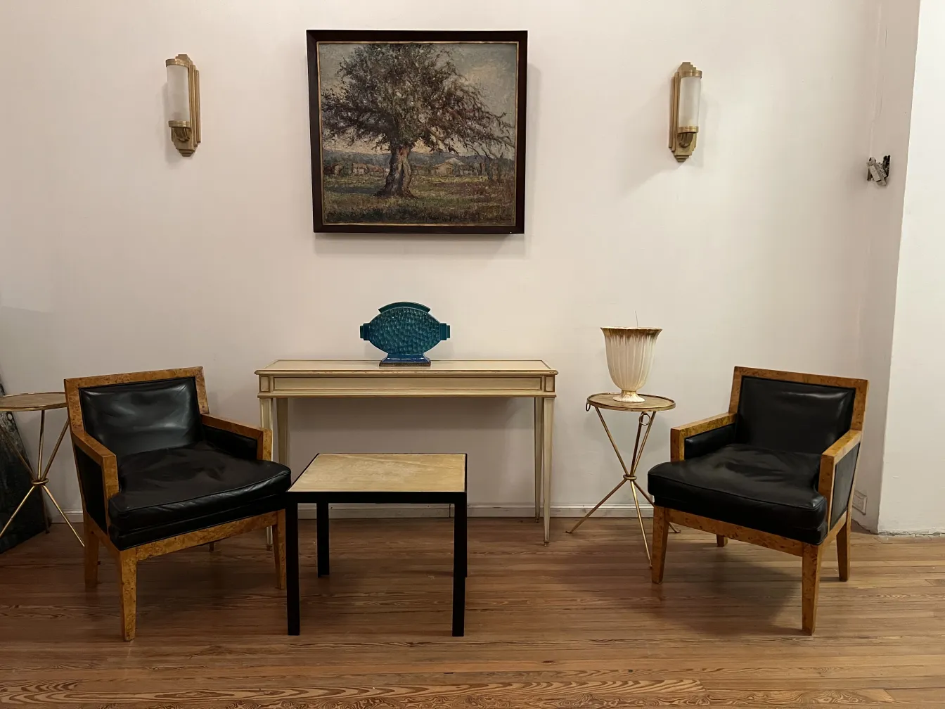 Two antique armchairs with decorative design in a cozy setting.
