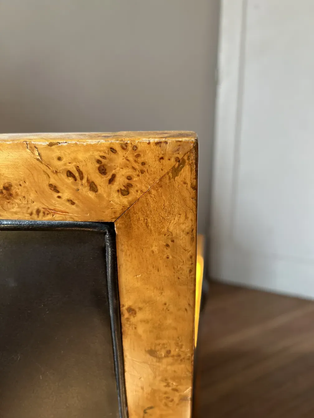 detail of an antique armchair with wood and black finishes