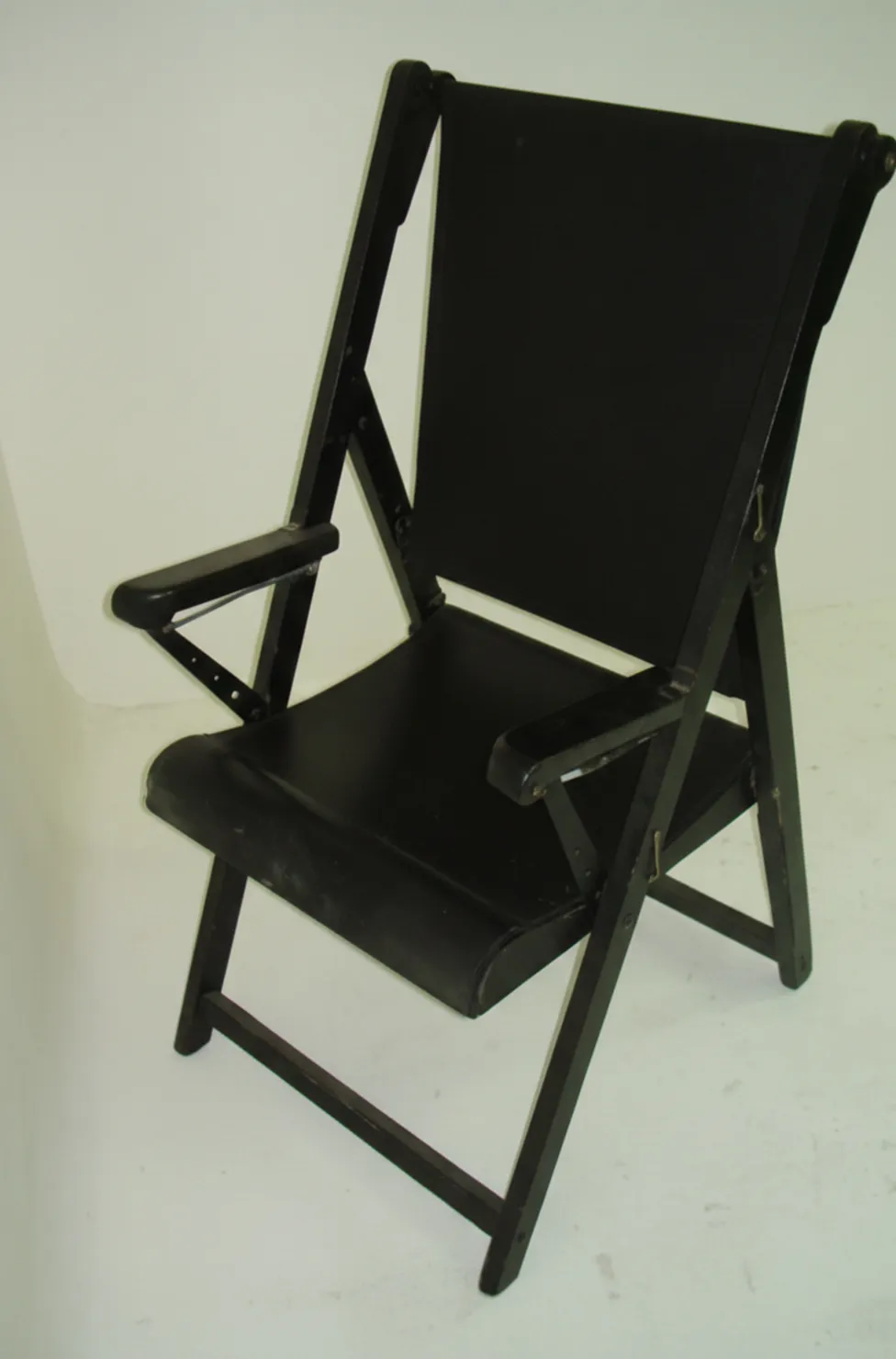 Two antique armchairs with arms and backrest, ready for restoration. Neutral background.