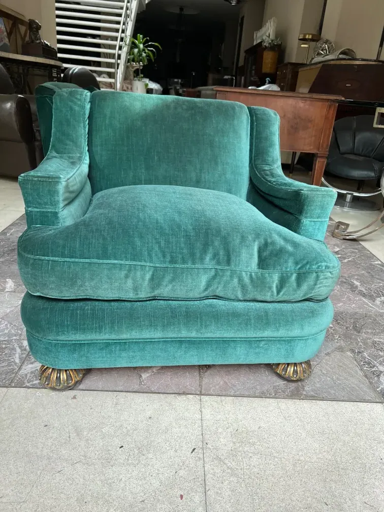 Vintage armchairs in green tones, needing restoration.