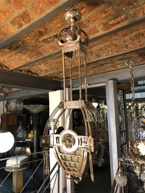 Antique hanging lamp in Mackintosh style, distinctive design and contemporary feel. Elegant ambiance with antique objects.