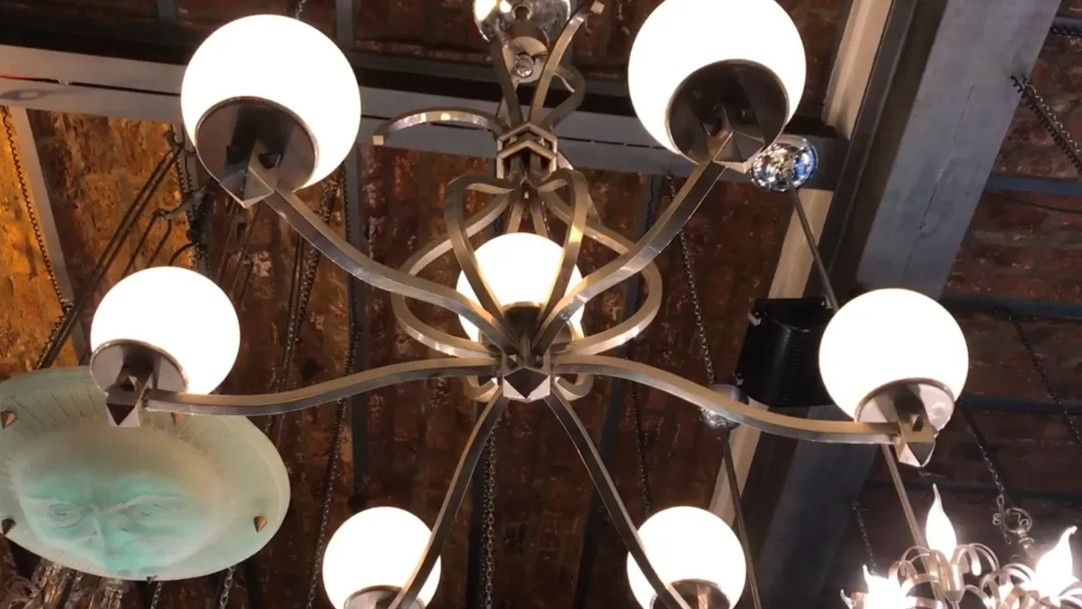 Antique hanging lamp in Art Deco style with round white lights