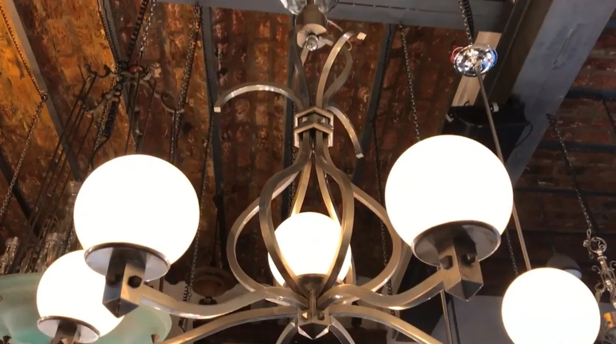 Antique hanging lamp art deco with elegant shapes and white spheres