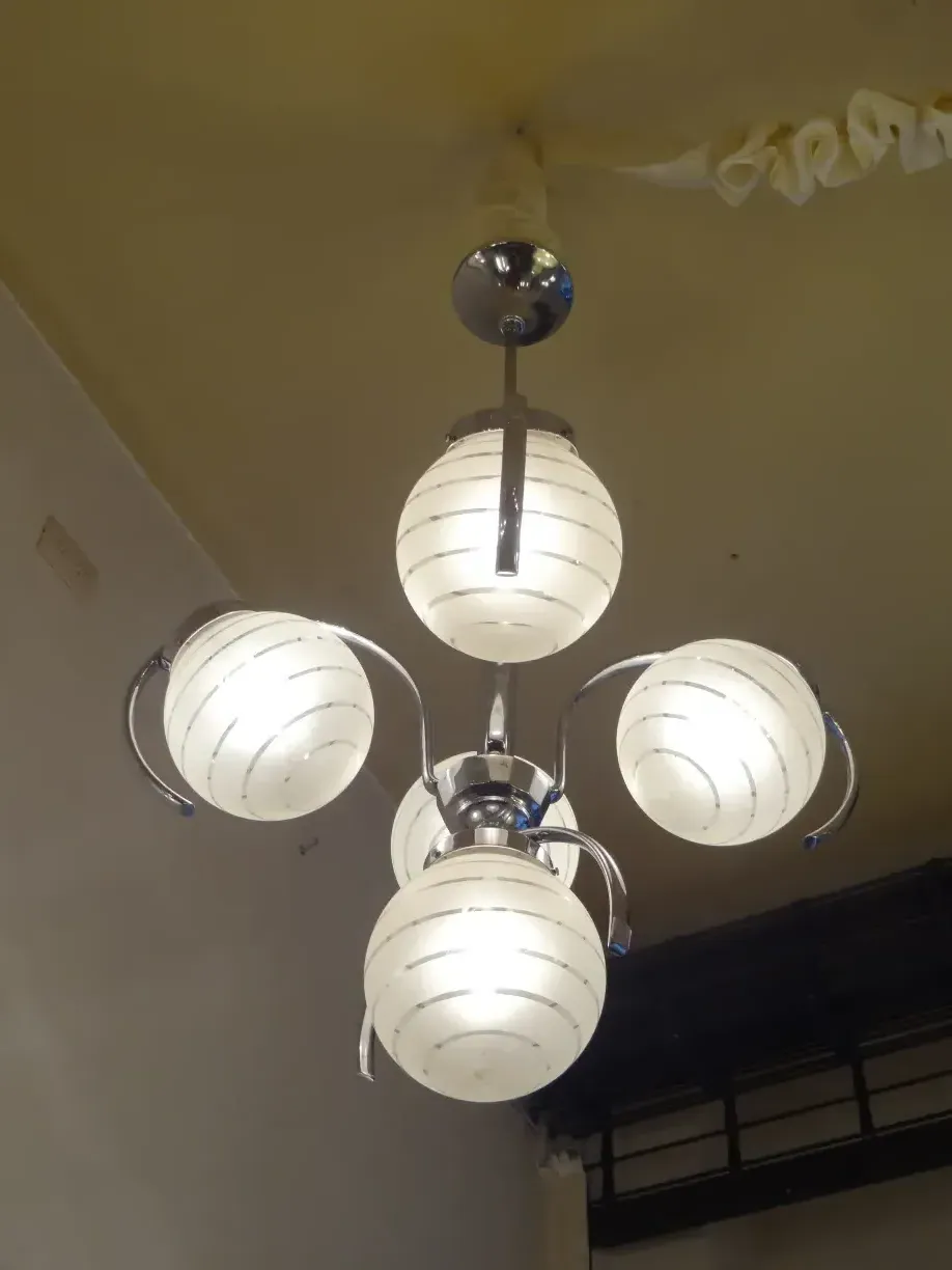 antique hanging lamp with three spherical lights in stylish setting