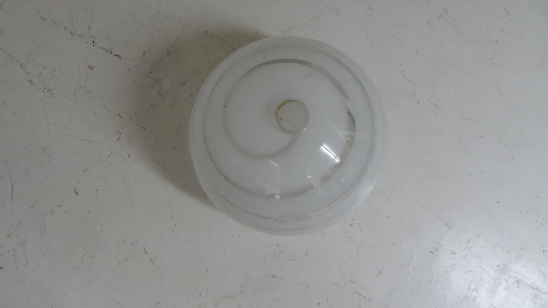 antique hanging lamp with a circular shape and simple design