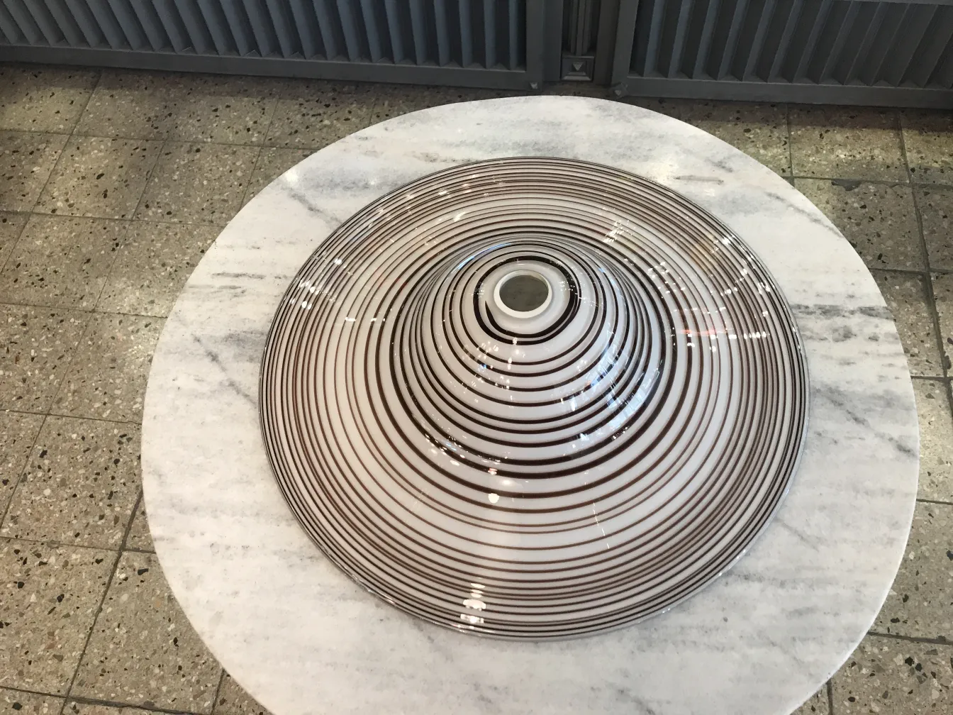 antique hanging lamp with spiral design on table