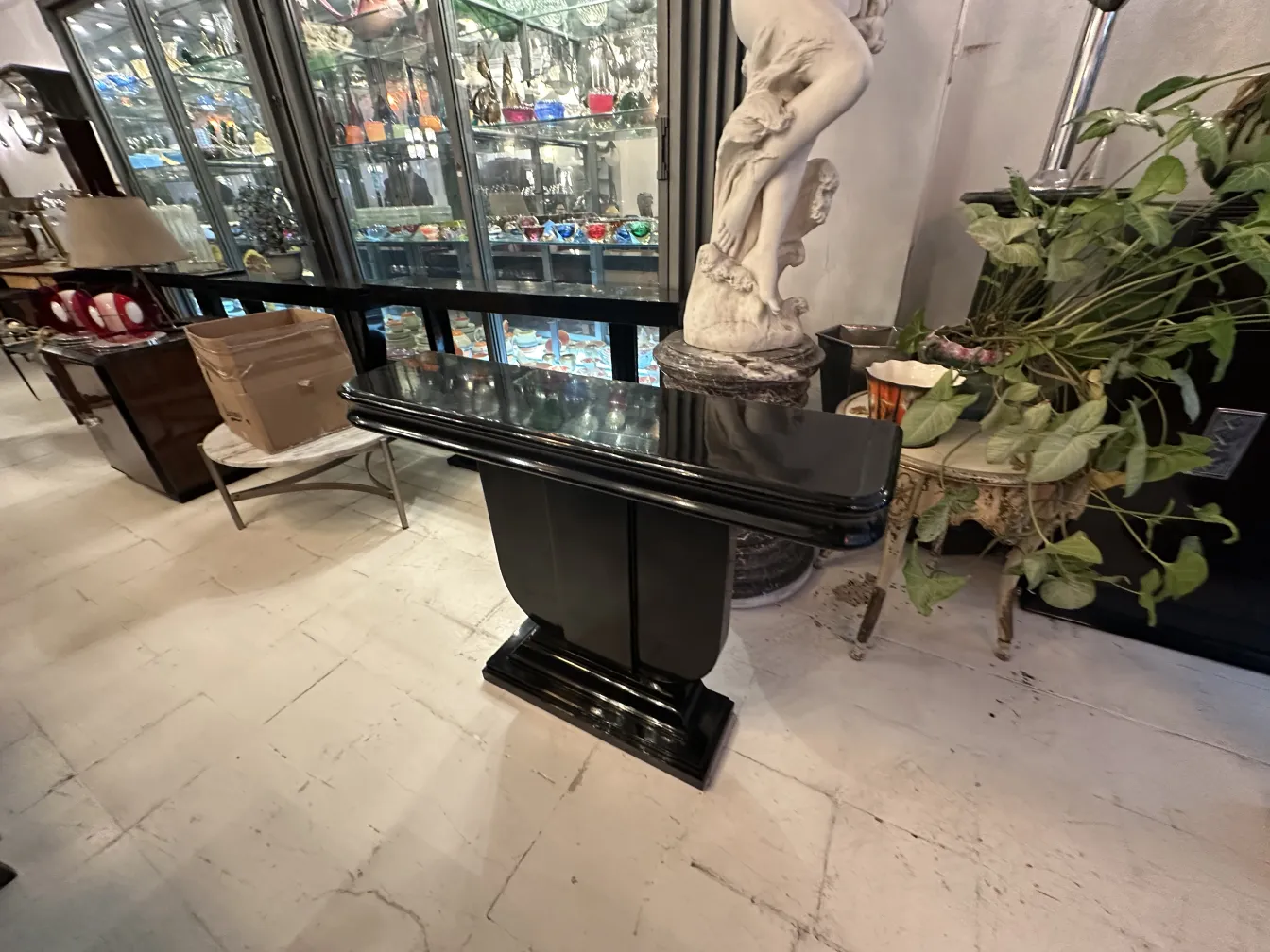 two antique consoles in a decorative setting