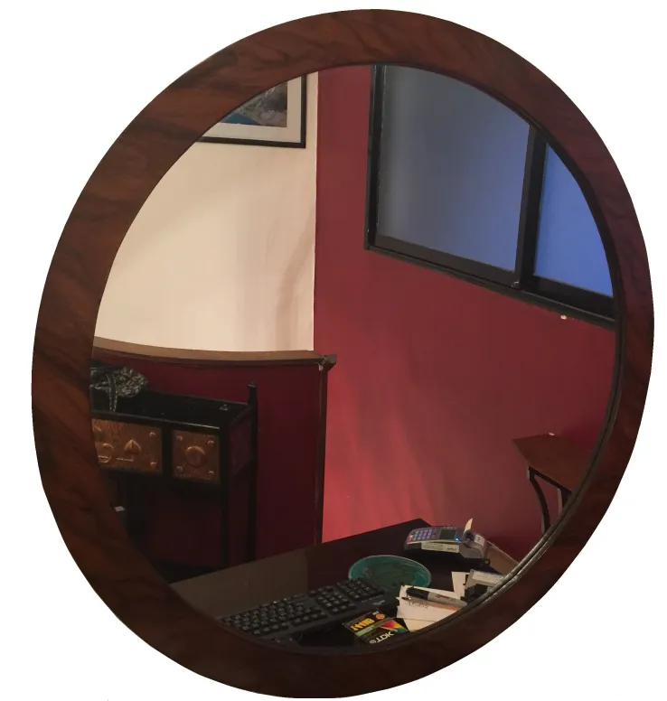 antique round mirror in a decorative room